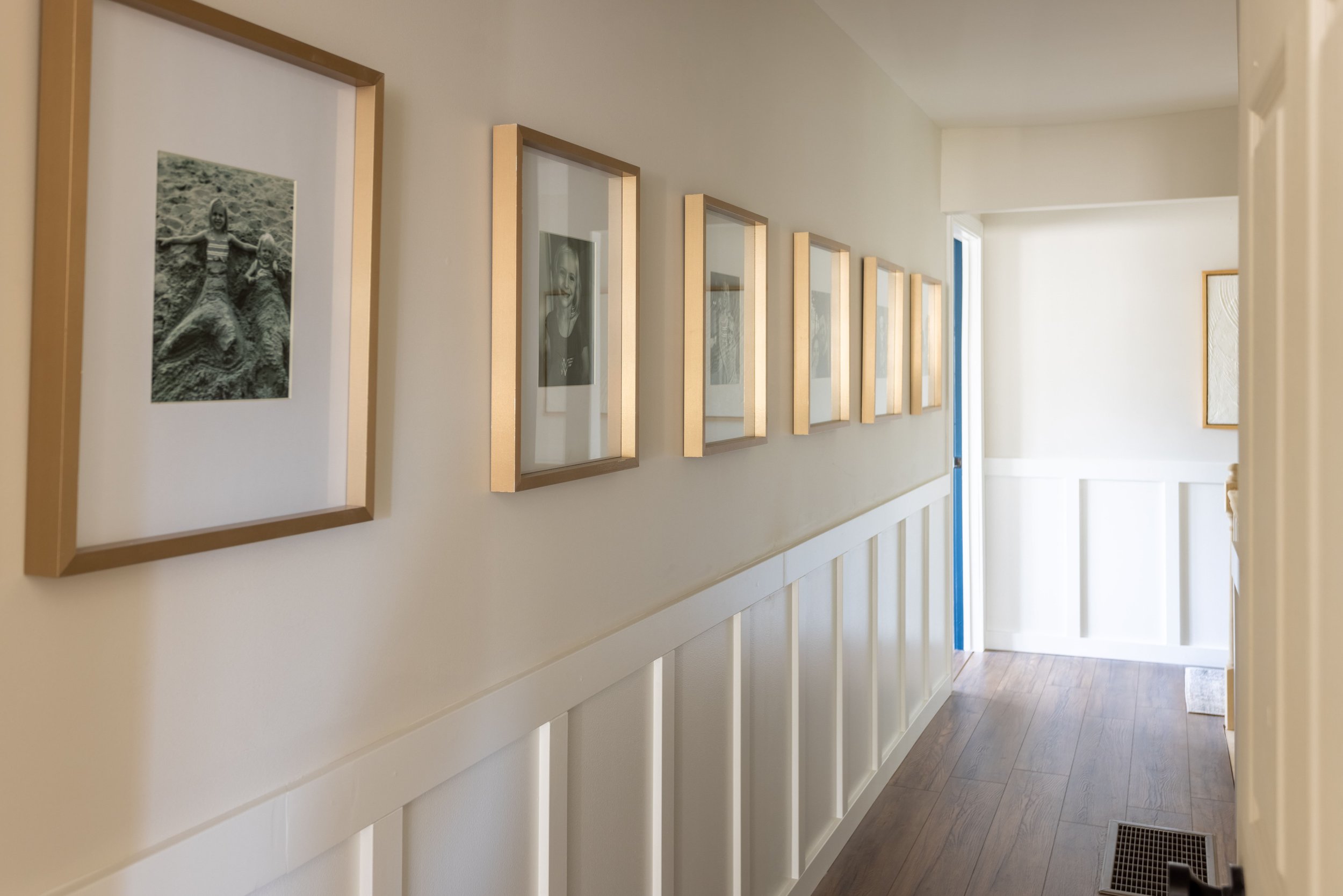 02-Boardand-Batten-Styled-Hallway-Corridor-wall-panels-hallway-paneling-ideas